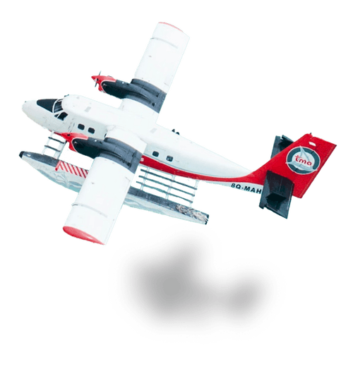 Tourist airplane flying over tropical island